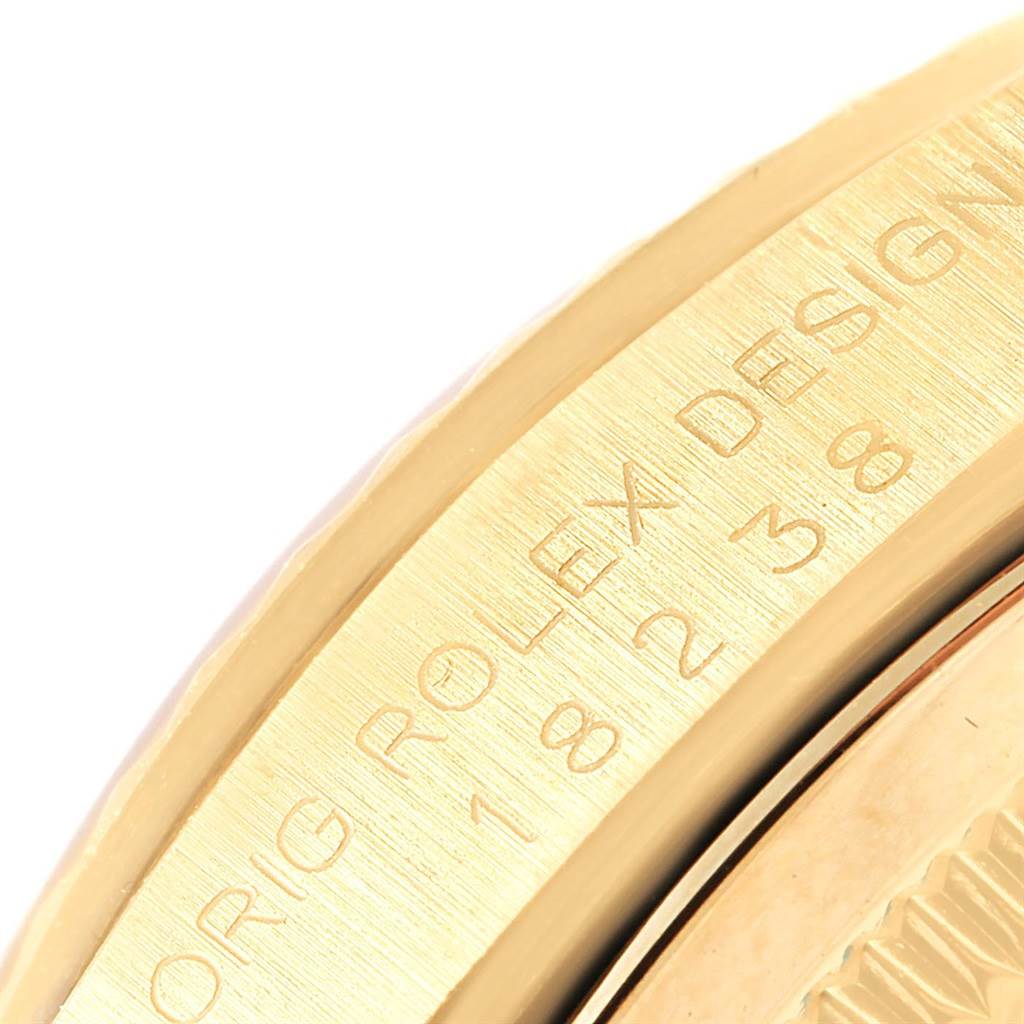 This close-up shows the case side with engravings of the Rolex President 18238 Men
s Yellow Gold Champagne Dial 18238 Men
s Yellow Gold Champagne Dial model watch.