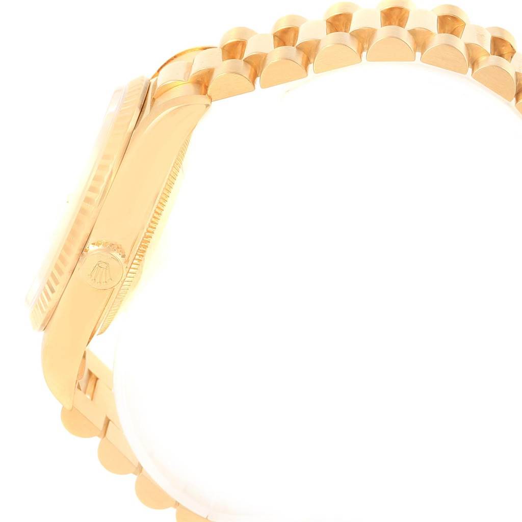 This image shows a side view of the Rolex President 18238 Men
s Yellow Gold Champagne Dial 18238 Men
s Yellow Gold Champagne Dial model watch, highlighting the case, crown, and part of the band.