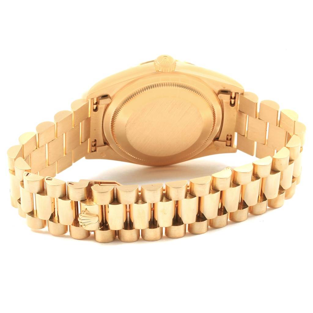 This image shows the back case and bracelet of a Rolex President 18238 Men
s Yellow Gold Champagne Dial 18238 Men
s Yellow Gold Champagne Dial model watch from a rear angle.