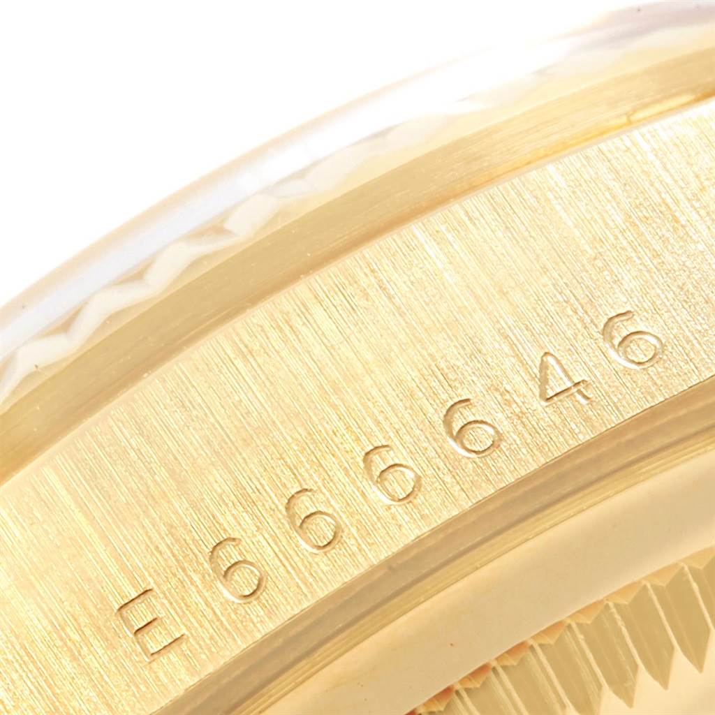 The image shows a close-up of the serial number on the side of the Rolex President 18238 Men
s Yellow Gold Champagne Dial 18238 Men
s Yellow Gold Champagne Dial watch’s case.