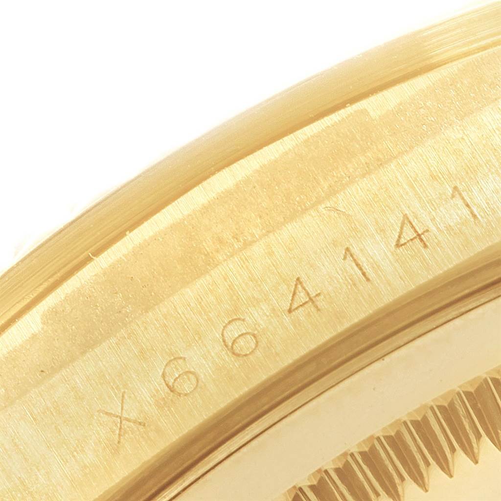 This image displays a close-up of the case side and bezel teeth of a Rolex President 18238 Men
s Yellow Gold Black Dial 18238 Men
s Yellow Gold Black Dial model watch.