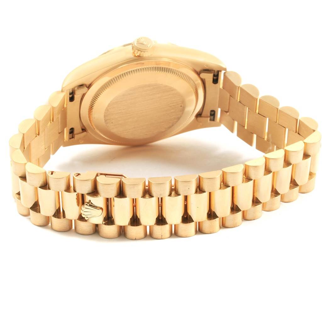 The image shows the backside and bracelet of a Rolex President 18238 Men
s Yellow Gold Black Dial 18238 Men
s Yellow Gold Black Dial model watch at an angled view from the back.