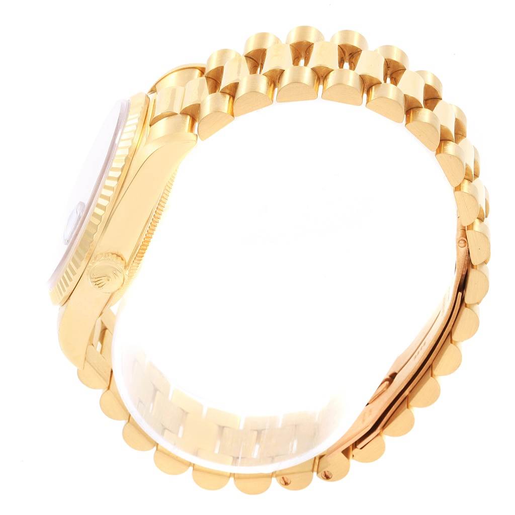 The image shows a side view of a Rolex President 18238 Men
s Yellow Gold Black Dial 18238 Men
s Yellow Gold Black Dial model watch, highlighting the gold case and bracelet.