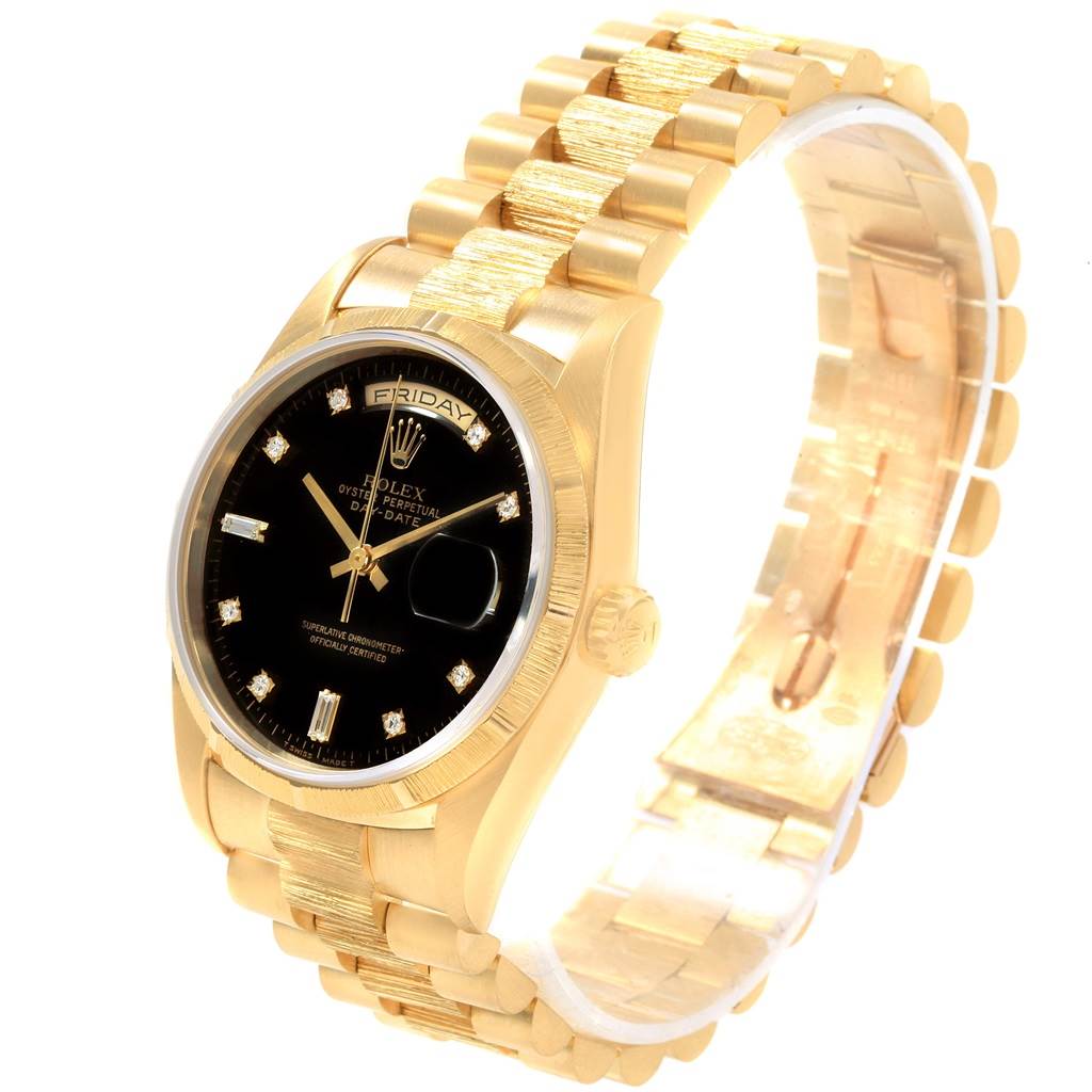 This image shows a side and top view of a Rolex President 18308 Men
s Yellow Gold Black Dial 18308 Men
s Yellow Gold Black Dial model watch, featuring its bracelet and black dial with diamond markers.