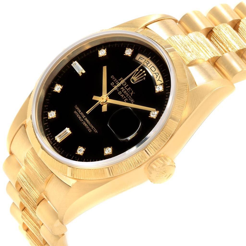 The image shows a close-up, angled view of a Rolex President 18308 Men
s Yellow Gold Black Dial 18308 Men
s Yellow Gold Black Dial model watch, highlighting the face, bezel, and bracelet.