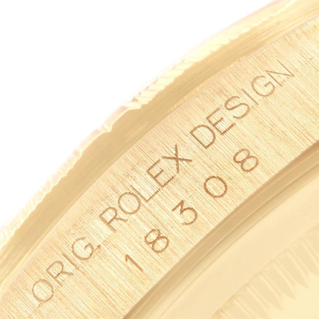 This image shows a close-up of the engraved bezel of a Rolex President 18308 Men
s Yellow Gold Black Dial 18308 Men
s Yellow Gold Black Dial model watch.