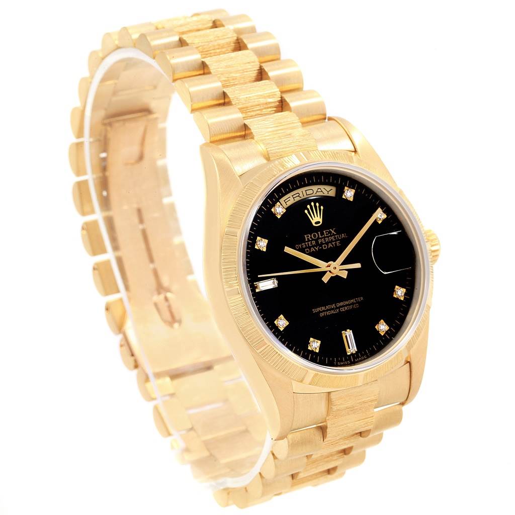 The Rolex President 18308 Men
s Yellow Gold Black Dial 18308 Men
s Yellow Gold Black Dial model is shown at a three-quarter angle, highlighting its gold bracelet, black dial, and day-date features.