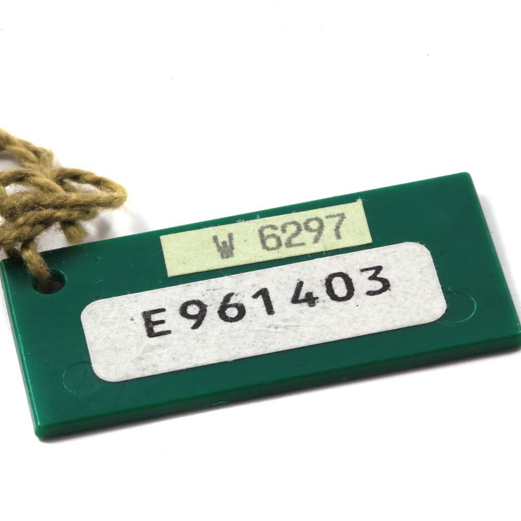 This shows a green tag with serial numbers for a Rolex President 18238 Men's Yellow Gold Champagne Dial 18238 Men's Yellow Gold Champagne Dial model watch.