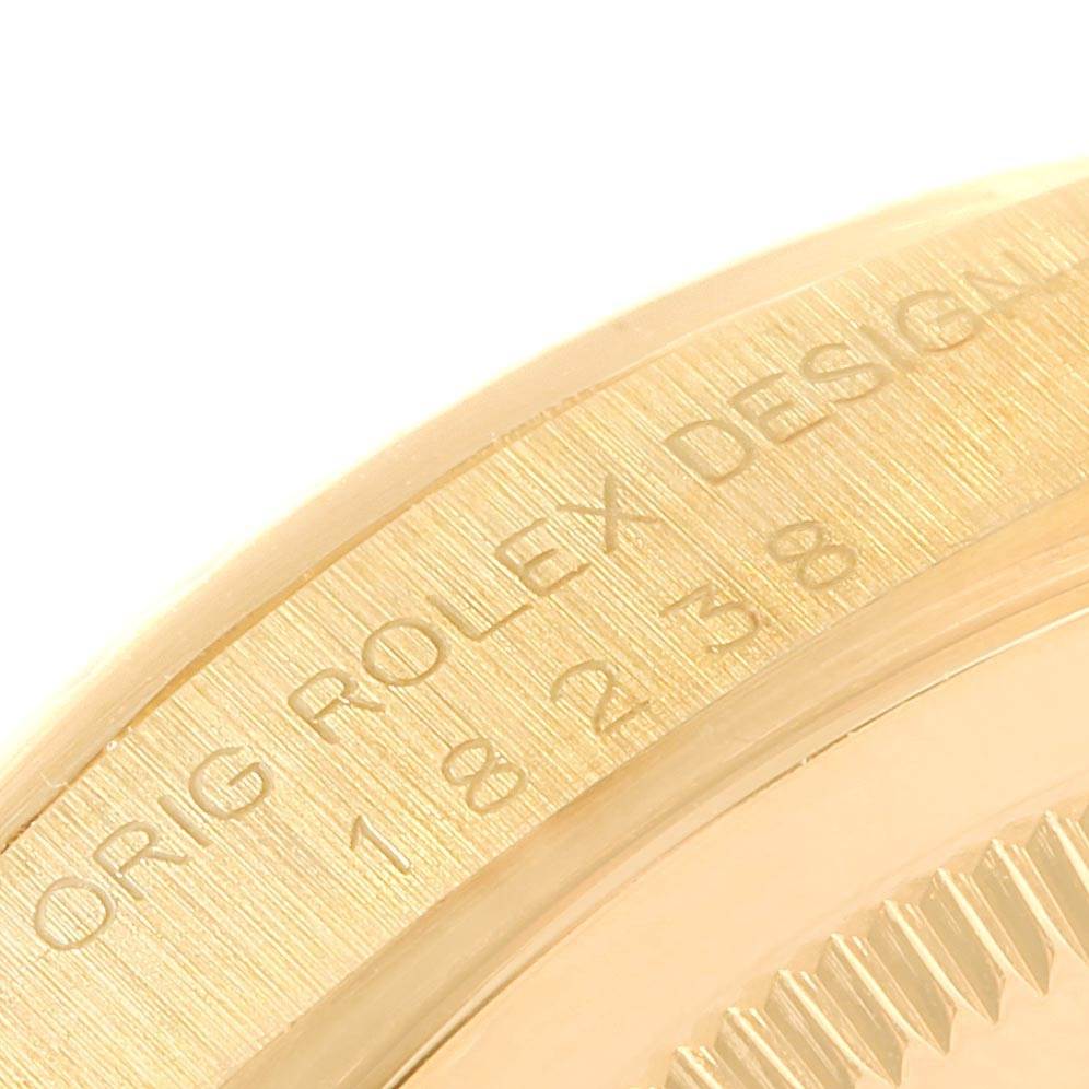 This image shows a close-up of the side with engravings of the Rolex President 18238 Men's Yellow Gold Champagne Dial 18238 Men's Yellow Gold Champagne Dial watch model.