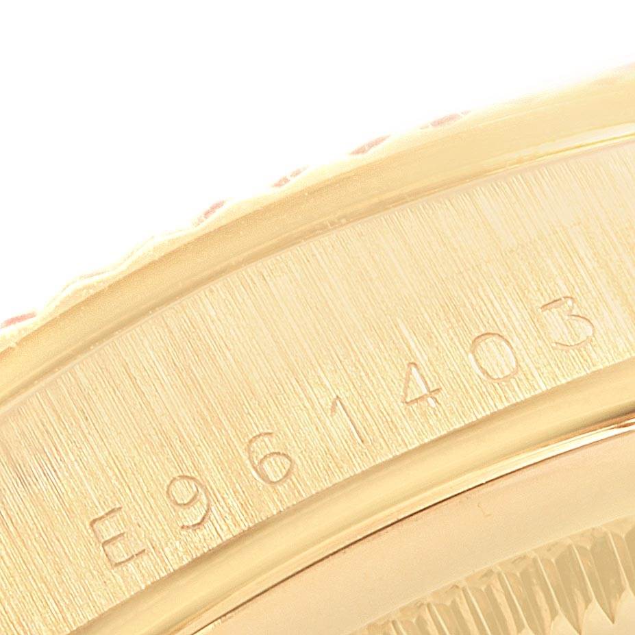 This image shows a close-up view of the serial number area on the bezel of the Rolex President 18238 Men's Yellow Gold Champagne Dial 18238 Men's Yellow Gold Champagne Dial model watch.