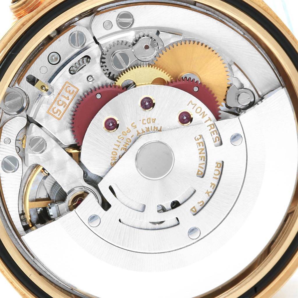 This image shows the open back view of the Rolex President 18238 Men's Yellow Gold Champagne Dial 18238 Men's Yellow Gold Champagne Dial model, revealing its intricate inner mechanical movement and gears.