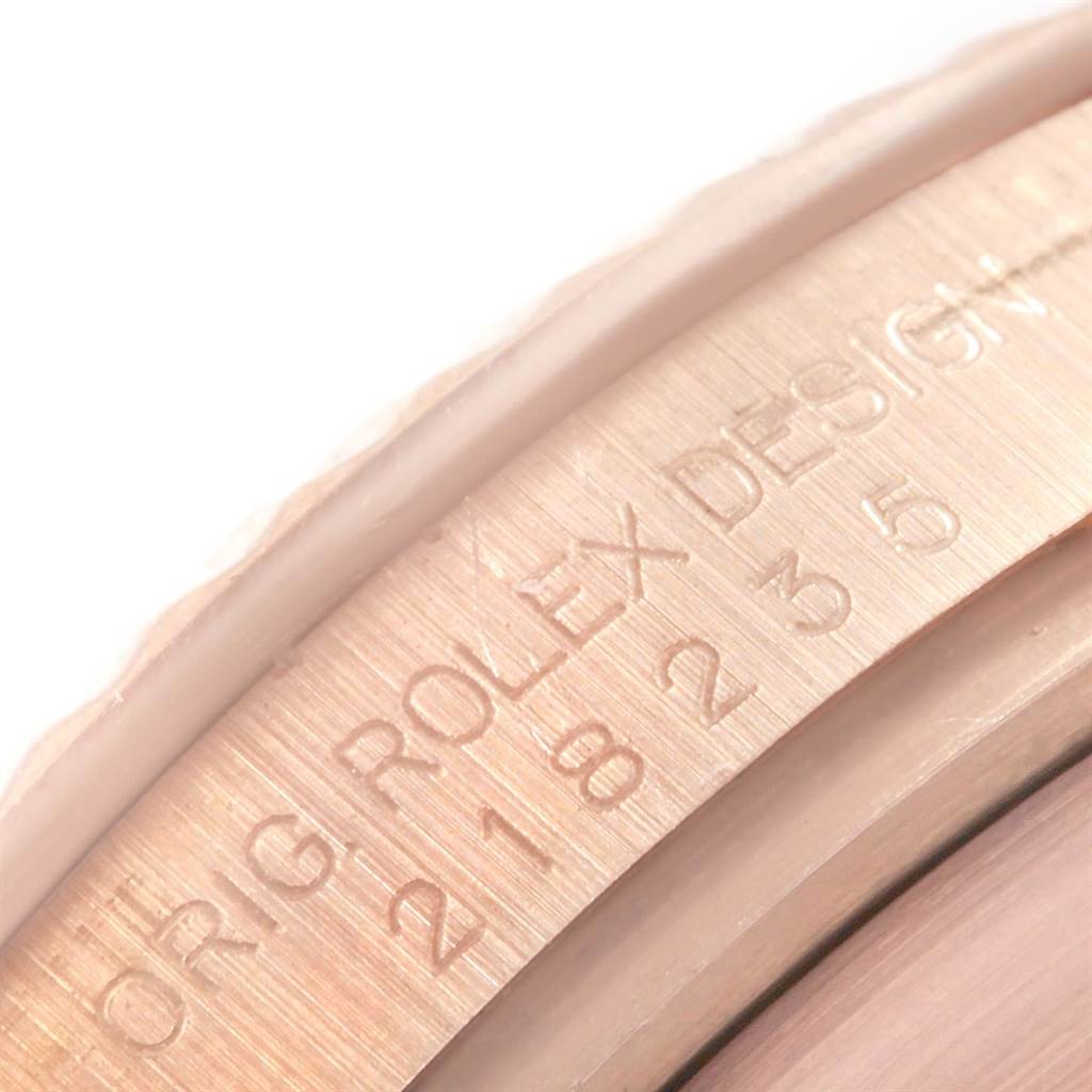 This close-up image shows the edge of the dial and inner bezel of a Rolex President 218235 Men's Rose Gold Pink Dial 218235 Men's Rose Gold Pink Dial model watch.