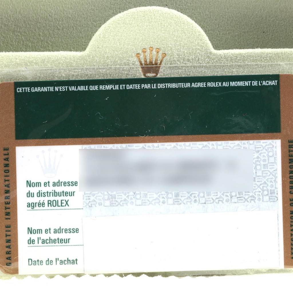 This is a close-up image of a Rolex President 218235 Men's Rose Gold Pink Dial 218235 Men's Rose Gold Pink Dial model warranty card with text fields for purchase details.