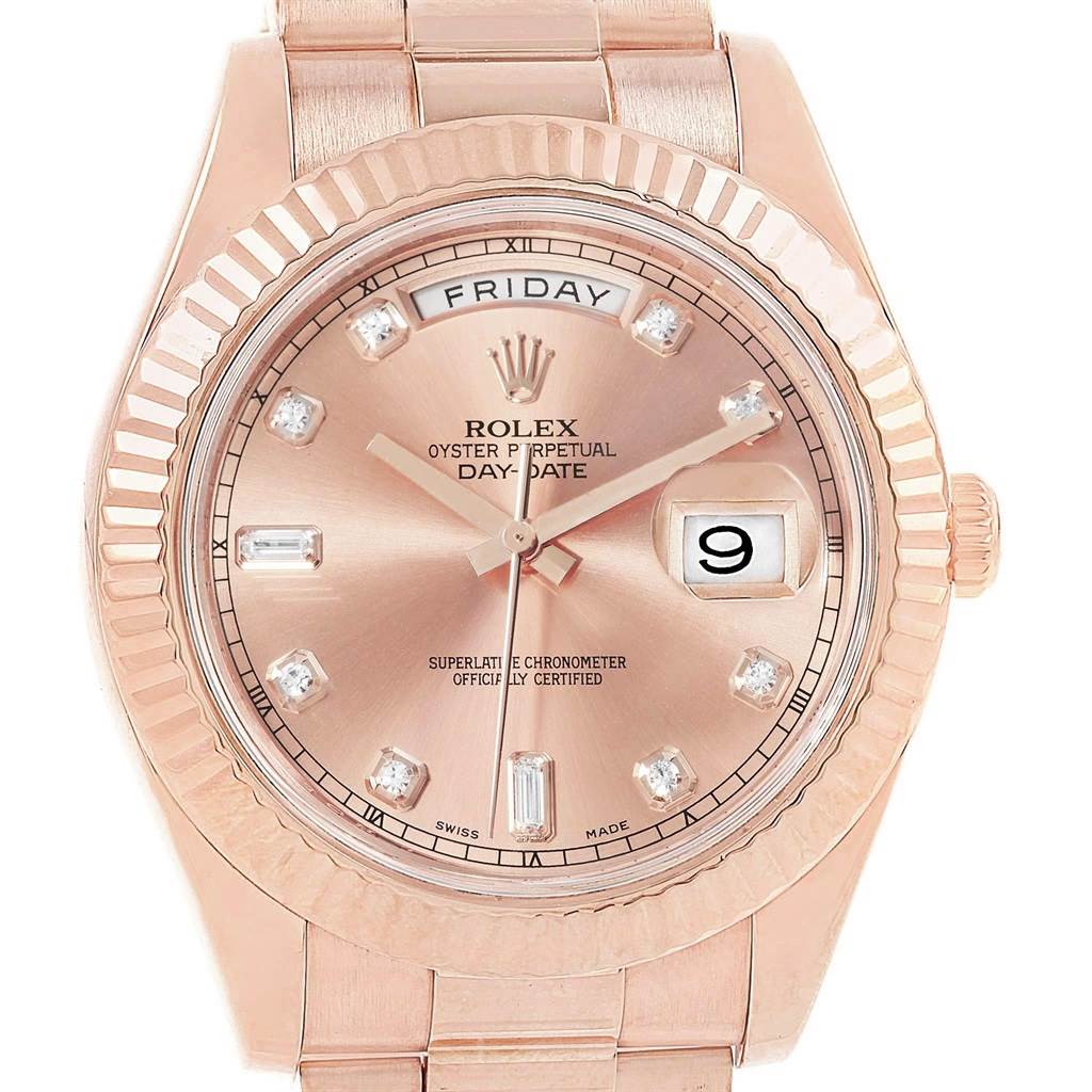 The image shows a front angle of a Rolex President 218235 Men's Rose Gold Pink Dial 218235 Men's Rose Gold Pink Dial model, showcasing its dial, bezel, day and date indicators, and bracelet.