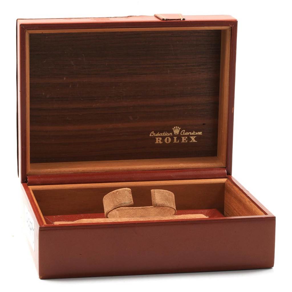 The image shows an open luxury watch box for a Rolex President 1803 Men
s White Gold Black Dial 1803 Men
s White Gold Black Dial model, revealing its interior and cushion display.