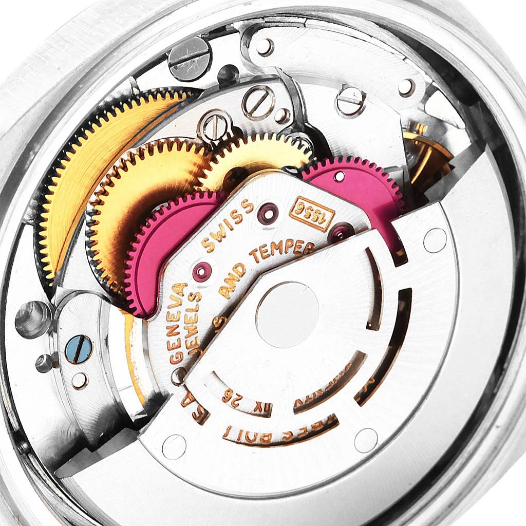 This image shows a close-up of the internal mechanism of a Rolex President 1803 Men
s White Gold Black Dial 1803 Men
s White Gold Black Dial model watch, highlighting gears and the Swiss movement.
