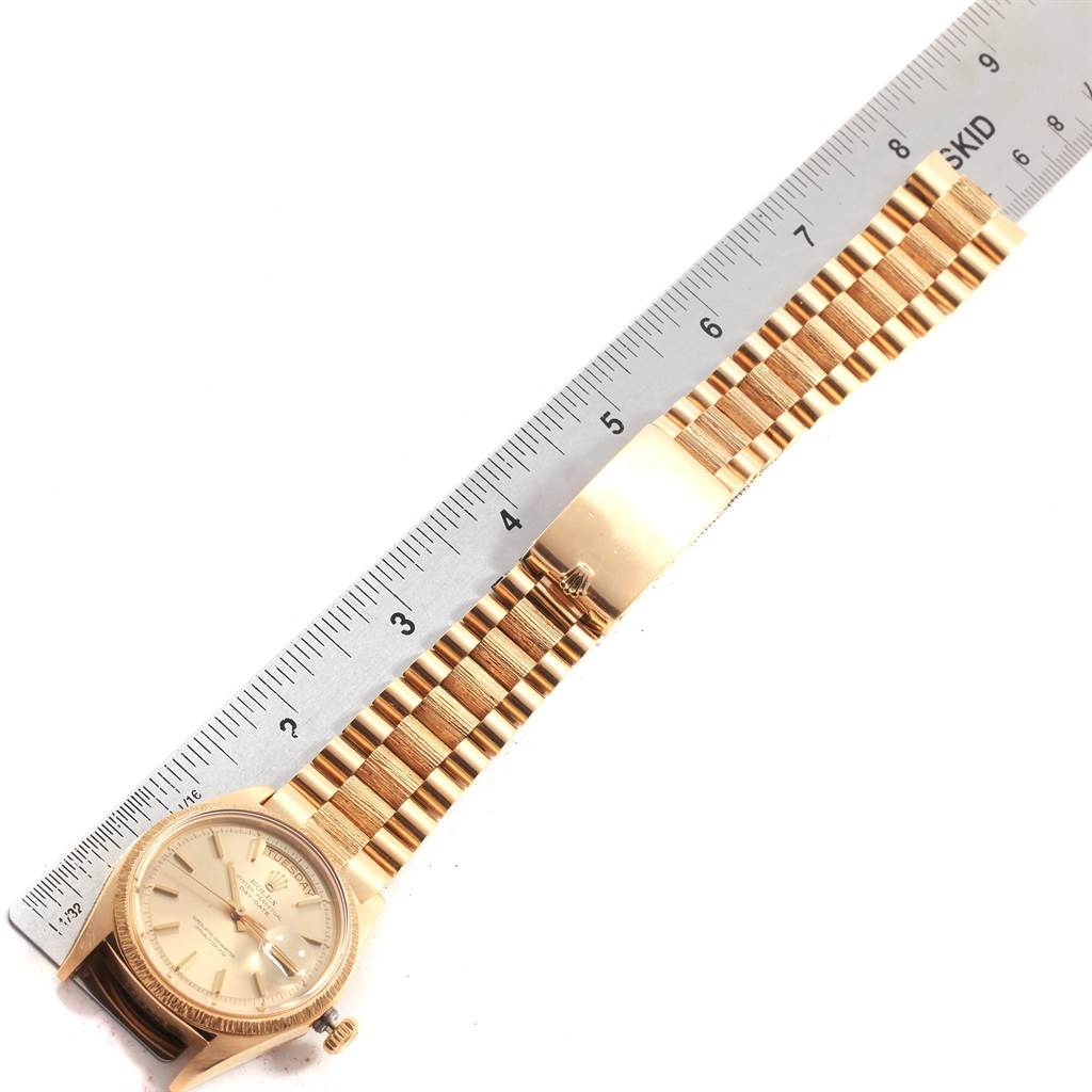 The image shows a Rolex President 1807 Men's Yellow Gold Champagne Dial 1807 Men's Yellow Gold Champagne Dial watch laid flat with its gold bracelet extended alongside a measuring ruler.