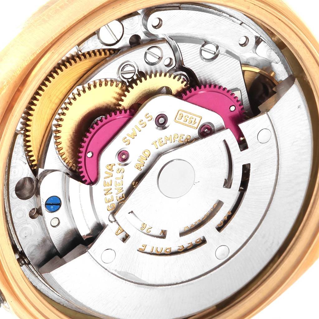 The image shows the intricate internal mechanism of a Rolex President 1807 Men's Yellow Gold Champagne Dial 1807 Men's Yellow Gold Champagne Dial model watch from a close-up angle.
