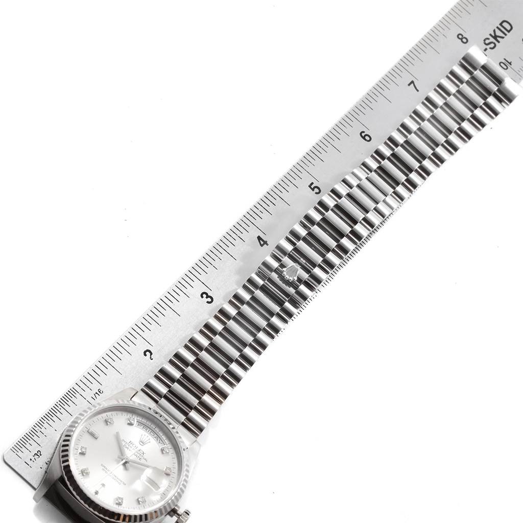 The image shows a side view of the President model by Rolex, displaying the face and bracelet length measured with a ruler.