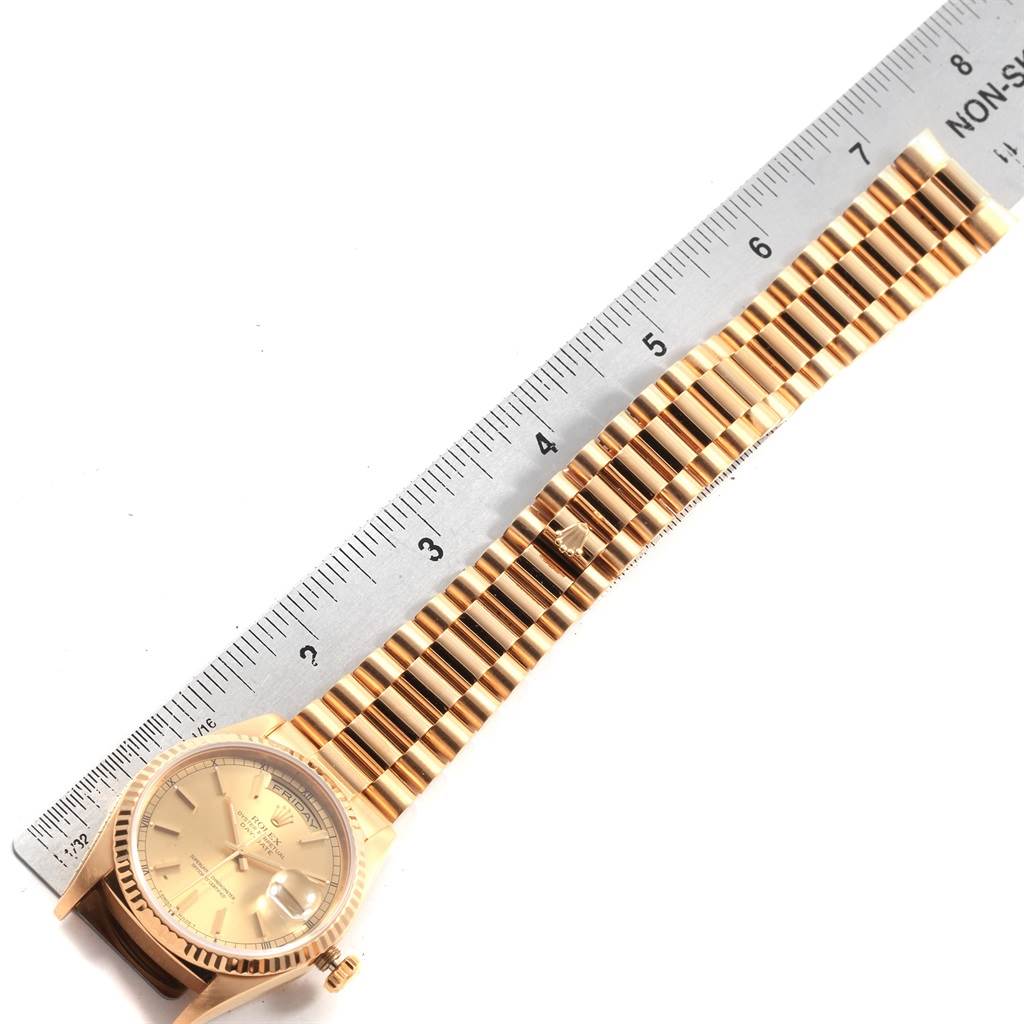 The image shows a top-down view of the Rolex President 20030 Men
s Yellow Gold Champagne Dial 20030 Men
s Yellow Gold Champagne Dial watch, including its face, bezel, and bracelet partially measured by a ruler.