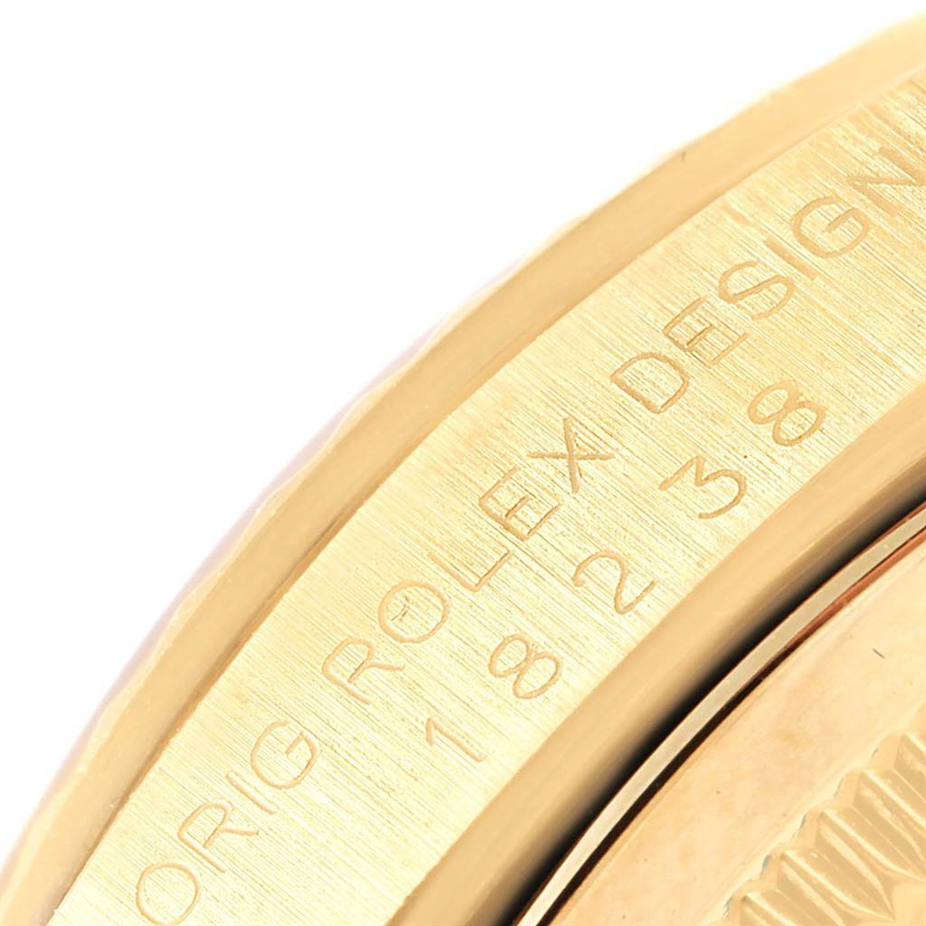 This close-up image shows the engraved side of a Rolex President 20030 Men
s Yellow Gold Champagne Dial 20030 Men
s Yellow Gold Champagne Dial model watch.