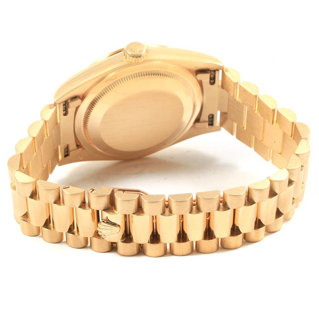 This image shows the back case and bracelet of a Rolex President 20030 Men
s Yellow Gold Champagne Dial 20030 Men
s Yellow Gold Champagne Dial model watch from a slightly angled rear view.