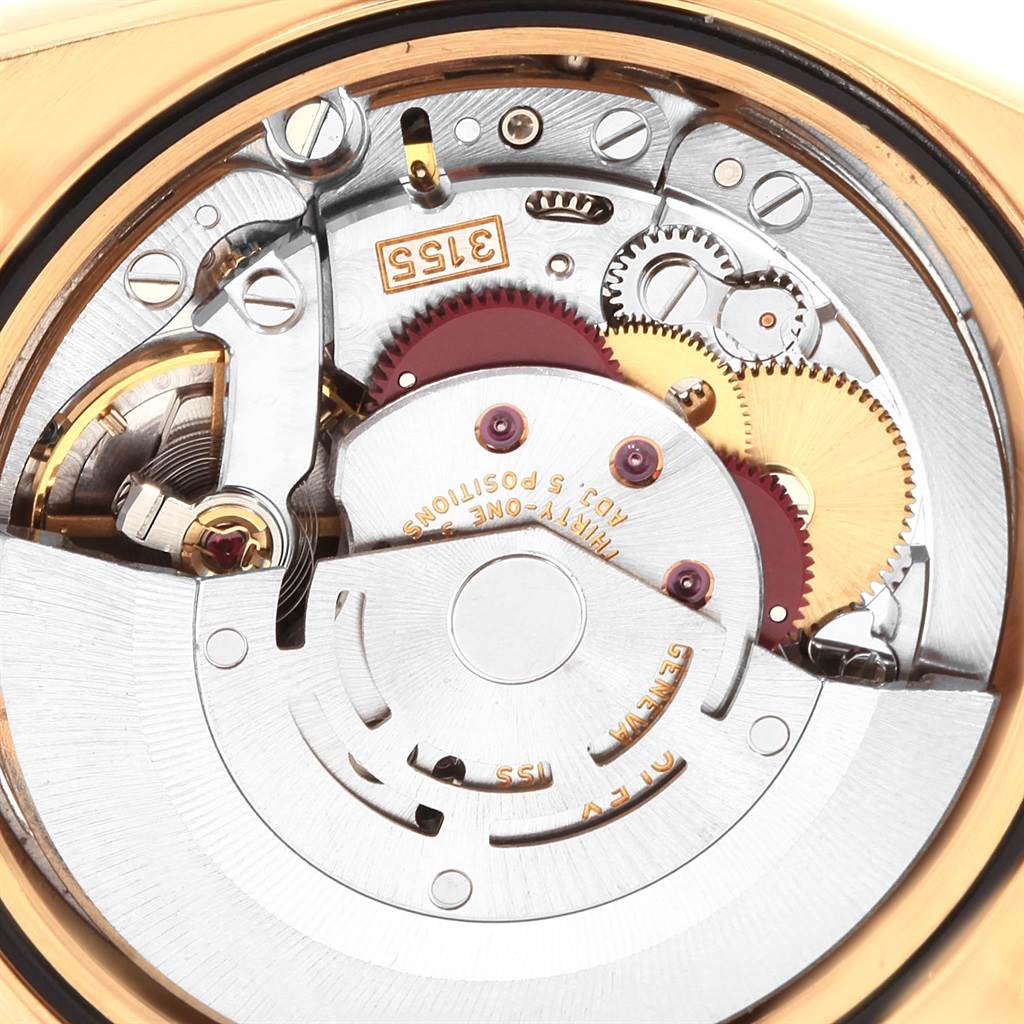 The image shows the intricate internal mechanics of a Rolex President 20030 Men
s Yellow Gold Champagne Dial 20030 Men
s Yellow Gold Champagne Dial model watch from a close-up, top-down angle.