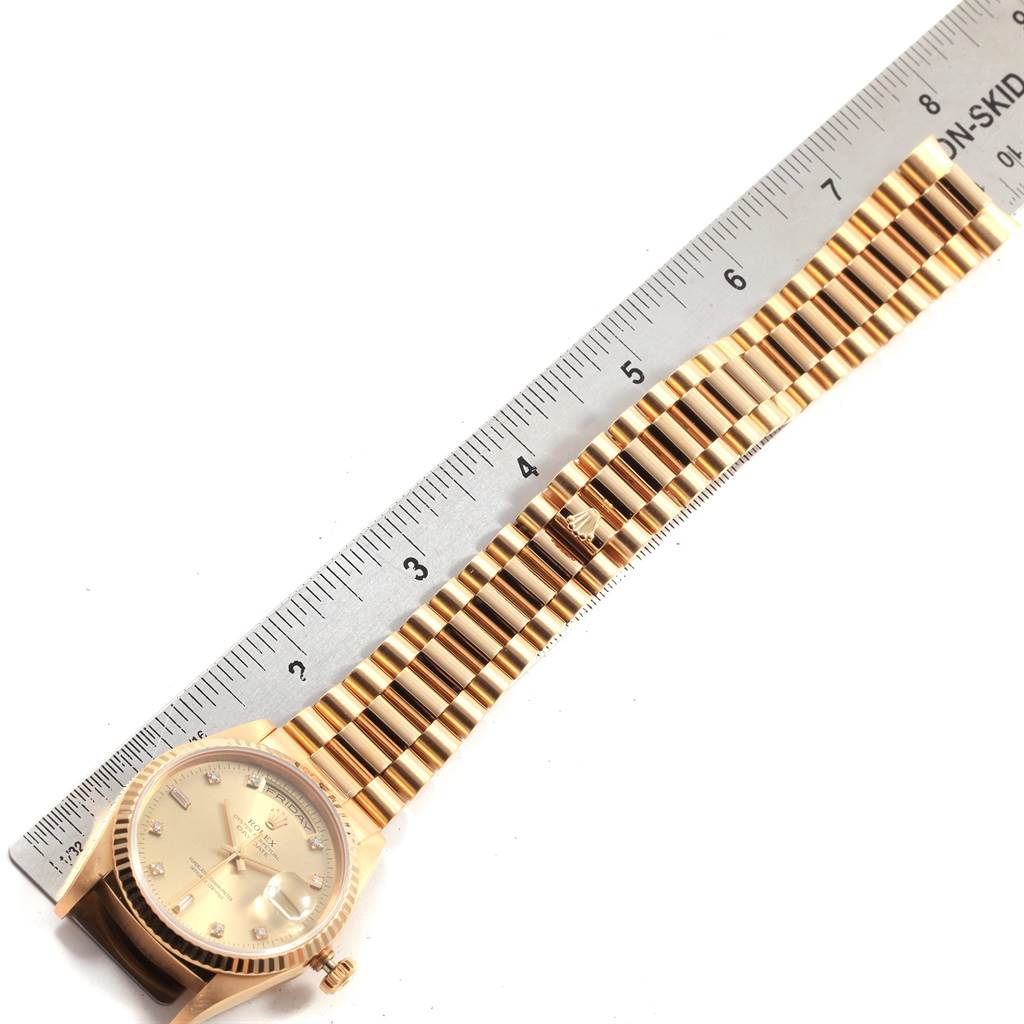 The image shows a Rolex President 18238 Men
s Yellow Gold Champagne Dial 18238 Men
s Yellow Gold Champagne Dial model watch from an aerial view, highlighting its dial, bracelet, and clasp.