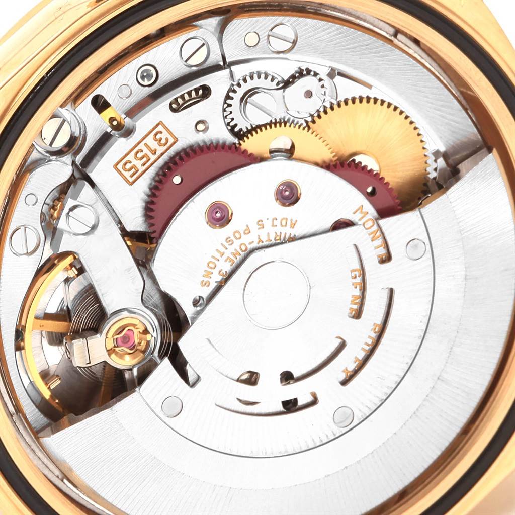 The image shows a close-up view of the internal movement mechanism of a Rolex President 18238 Men
s Yellow Gold Champagne Dial 18238 Men
s Yellow Gold Champagne Dial model watch, highlighting gears and components.