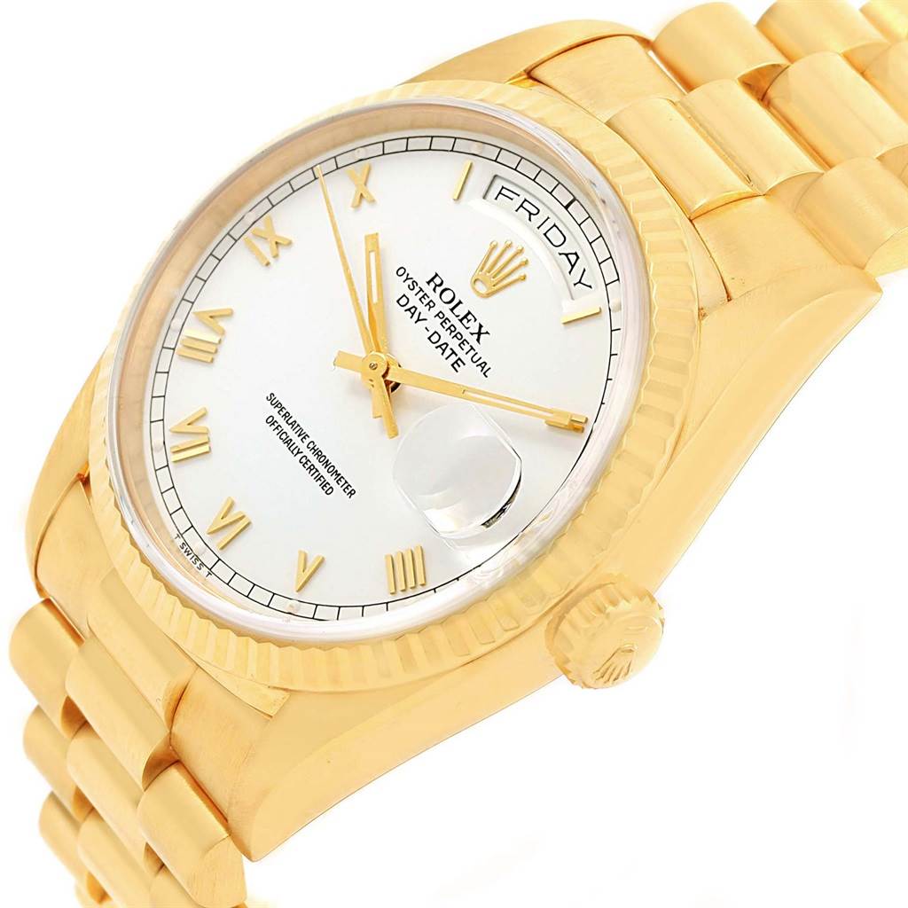 The image showcases a tilted close-up view of the Rolex President 18238 Men's Yellow Gold White Dial 18238 Men's Yellow Gold White Dial watch, featuring its gold case, white dial, and bracelet.