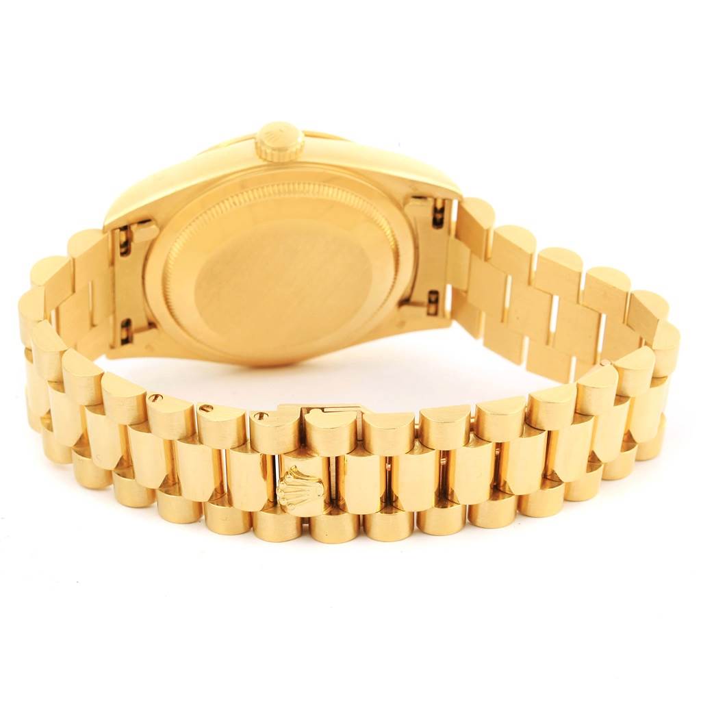 This image shows the case back and bracelet clasp of a Rolex President 18238 Men's Yellow Gold White Dial 18238 Men's Yellow Gold White Dial model watch from a rear angle.
