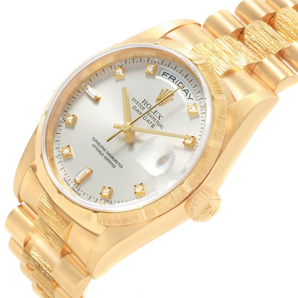 The Rolex President 18248 Men's Yellow Gold Silver Dial 18248 Men's Yellow Gold Silver Dial watch is shown from a front angle, displaying the dial, day-date window, and part of the gold bracelet.
