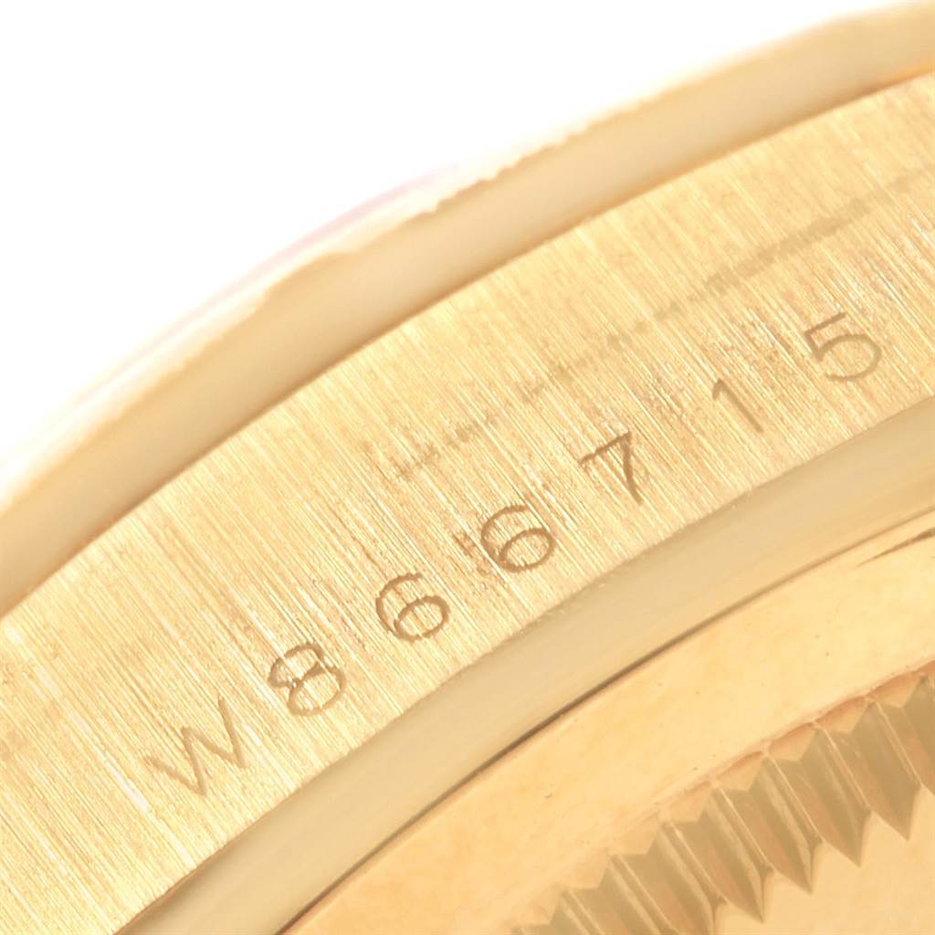 This close-up image shows the side case and part of the bezel of a Rolex President 18248 Men's Yellow Gold Silver Dial 18248 Men's Yellow Gold Silver Dial model watch.