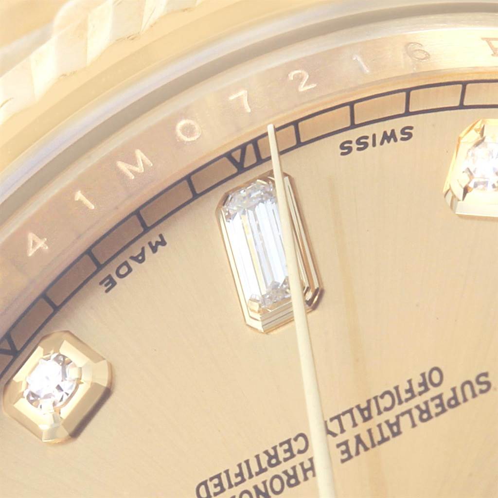 This close-up image of the Rolex President 218238 Men's Yellow Gold Champagne Dial 218238 Men's Yellow Gold Champagne Dial model displays part of the dial, including diamond hour markers and text.