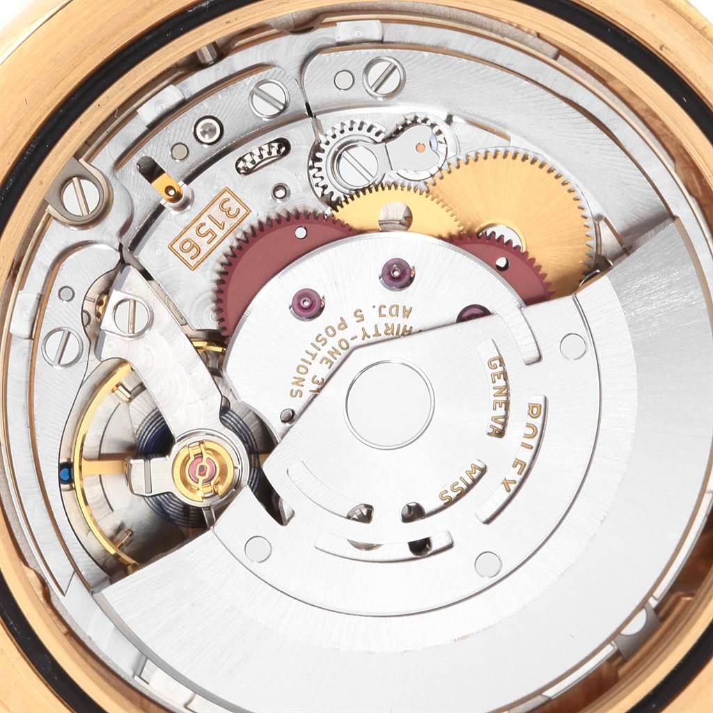 This image shows a close-up of the movement and internal gears of a Rolex President 218238 Men's Yellow Gold Champagne Dial 218238 Men's Yellow Gold Champagne Dial watch.