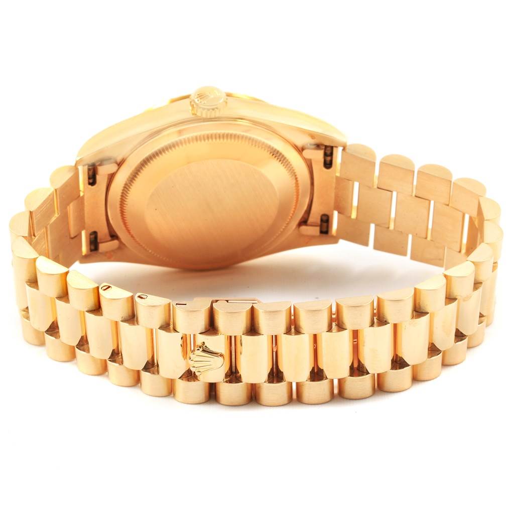 The image shows the back case and bracelet of the Rolex President 18238 Men
s Yellow Gold Champagne Dial 18238 Men
s Yellow Gold Champagne Dial model watch, viewed from an angle that highlights the clasp and links.
