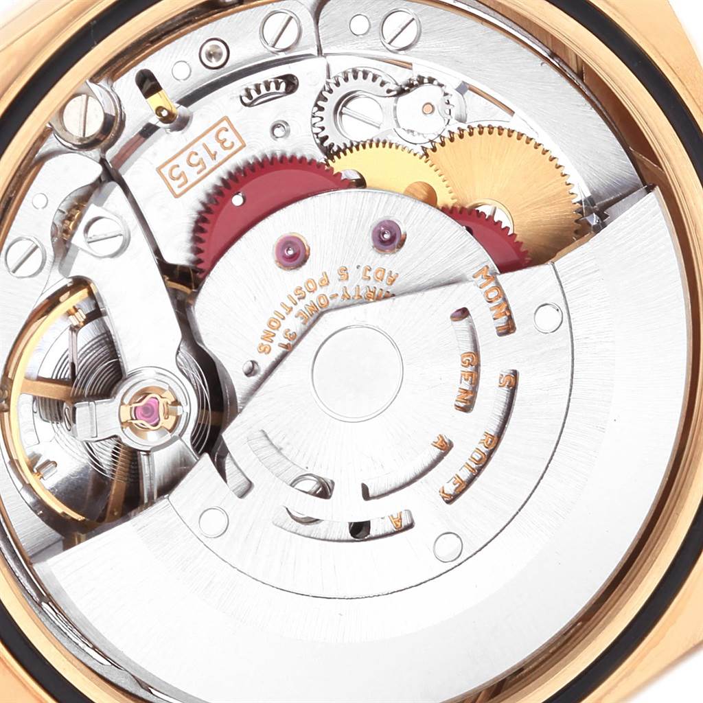 This is an image of the Rolex President 18238 Men
s Yellow Gold Champagne Dial 18238 Men
s Yellow Gold Champagne Dial model
s movement, showcasing the intricate gears and mechanical components from a close-up angle.