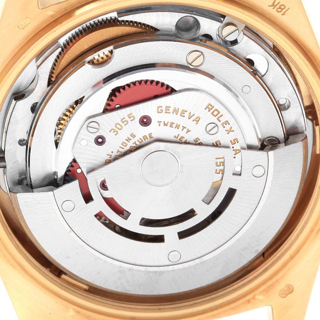 The image shows a close-up of the internal mechanism of a Rolex President 18108 Men
s Yellow Gold Champagne Dial 18108 Men
s Yellow Gold Champagne Dial watch from the back, revealing the movement parts.
