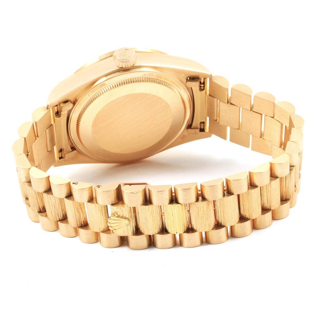The image shows the backside and bracelet of a Rolex President 18108 Men
s Yellow Gold Champagne Dial 18108 Men
s Yellow Gold Champagne Dial model watch, displaying the case and clasp.