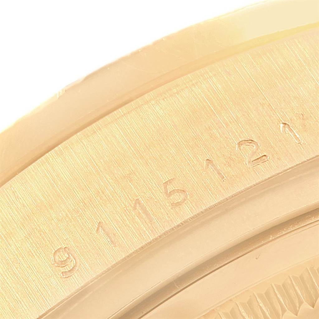 This close-up image shows a part of the bezel and serial number engraving on the Rolex President 18108 Men
s Yellow Gold Champagne Dial 18108 Men
s Yellow Gold Champagne Dial model watch.