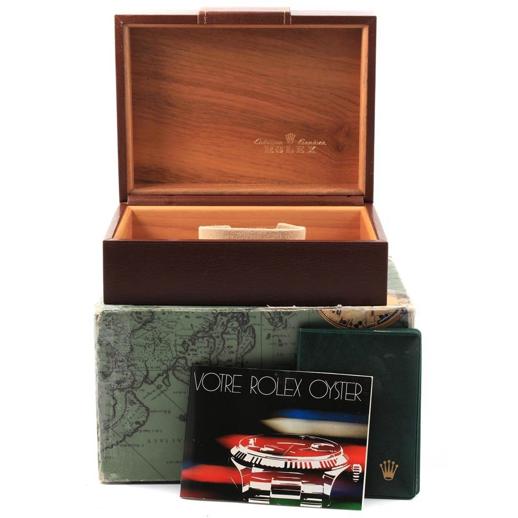 The image shows the open wooden box for a Rolex President 18108 Men
s Yellow Gold Champagne Dial 18108 Men
s Yellow Gold Champagne Dial model, along with its manual and green cardholder.