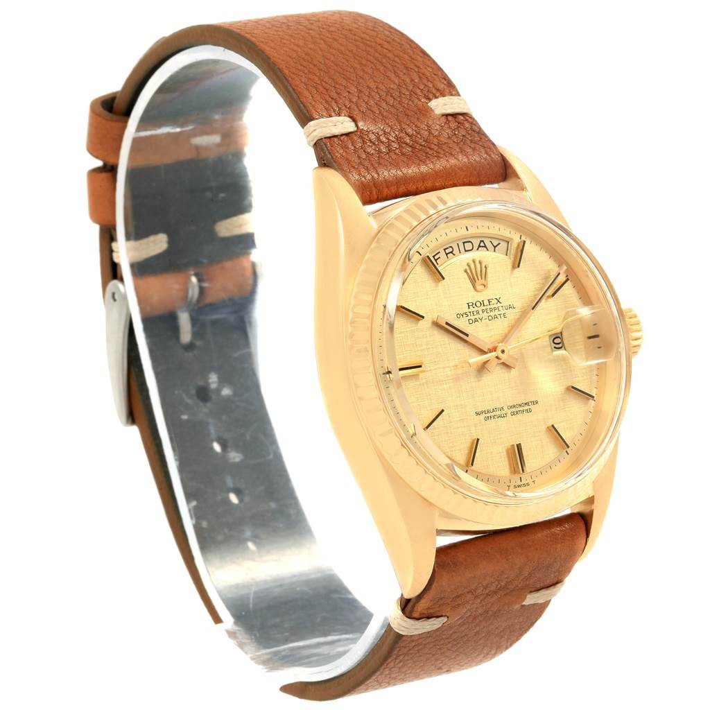 The Rolex President 1803 Men
s Yellow Gold Champagne Dial 1803 Men
s Yellow Gold Champagne Dial model watch is shown at a slight angle, highlighting its golden dial, date feature, and brown leather strap.