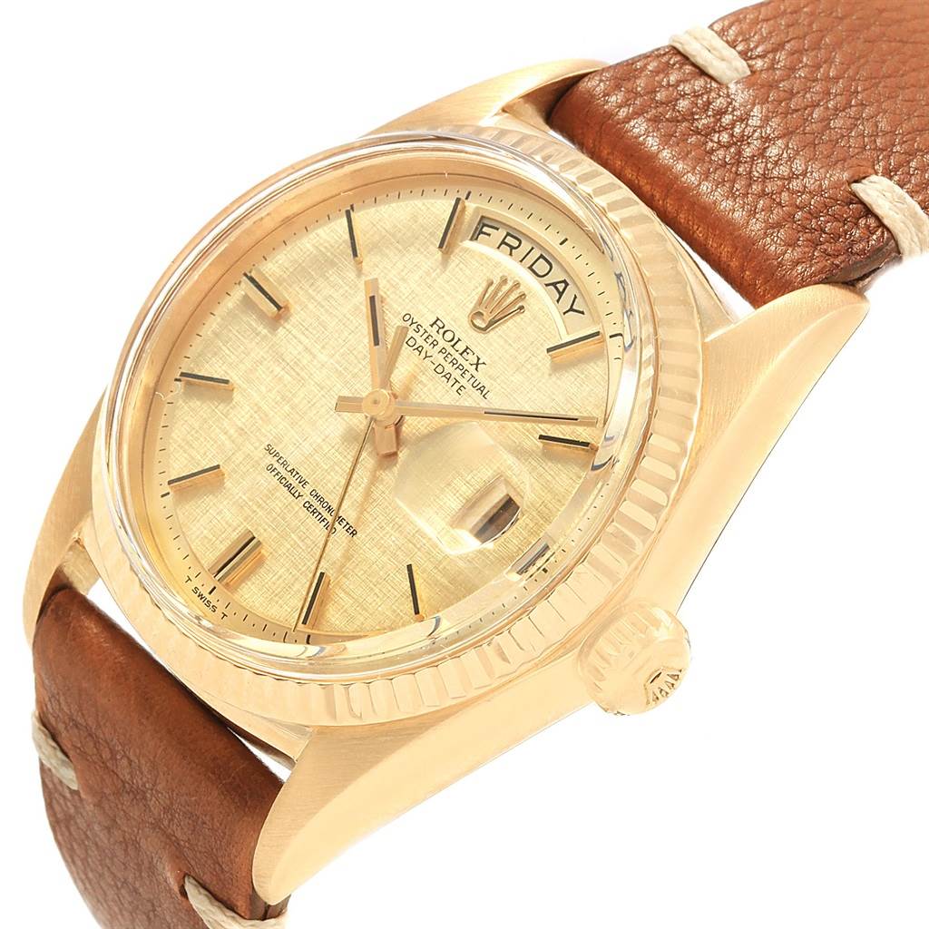 The image shows a close-up of a Rolex President 1803 Men
s Yellow Gold Champagne Dial 1803 Men
s Yellow Gold Champagne Dial watch, highlighting the dial, bezel, crown, and part of the leather strap.