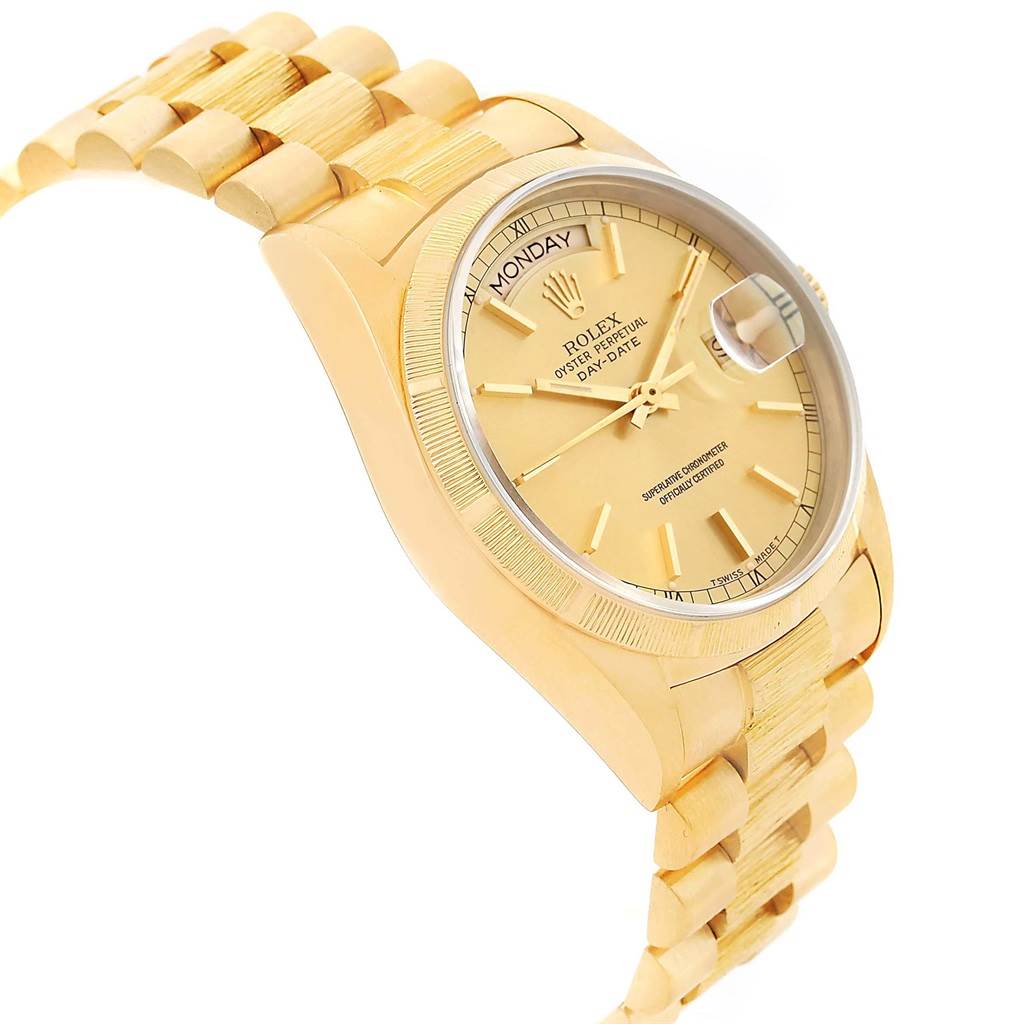 The Rolex President 18078 Men
s Yellow Gold Champagne Dial 18078 Men
s Yellow Gold Champagne Dial model watch is shown at an angled side view, displaying its gold band, bezel, crown, and dial.