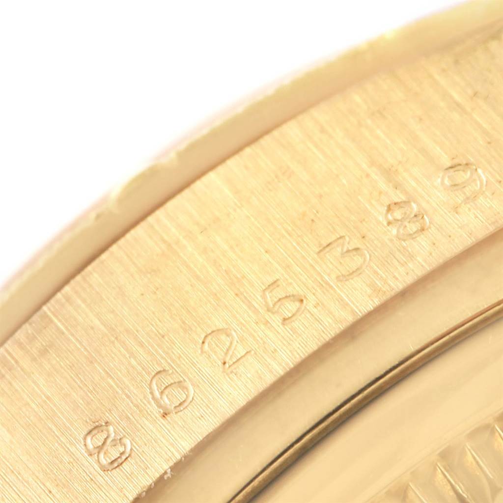 The image shows a close-up of the engraved bezel on a Rolex President 18078 Men
s Yellow Gold Champagne Dial 18078 Men
s Yellow Gold Champagne Dial model watch.