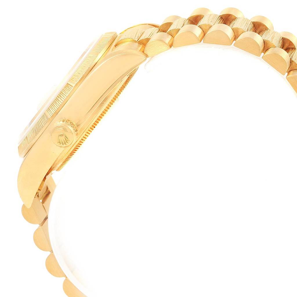 This image shows a side view of the Rolex President 18078 Men
s Yellow Gold Champagne Dial 18078 Men
s Yellow Gold Champagne Dial model watch, highlighting the case, crown, and part of the bracelet.