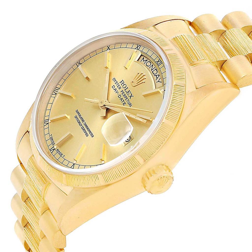 The image shows a side angle of a gold Rolex President 18078 Men
s Yellow Gold Champagne Dial 18078 Men
s Yellow Gold Champagne Dial model watch, highlighting the dial, case, and part of the bracelet.
