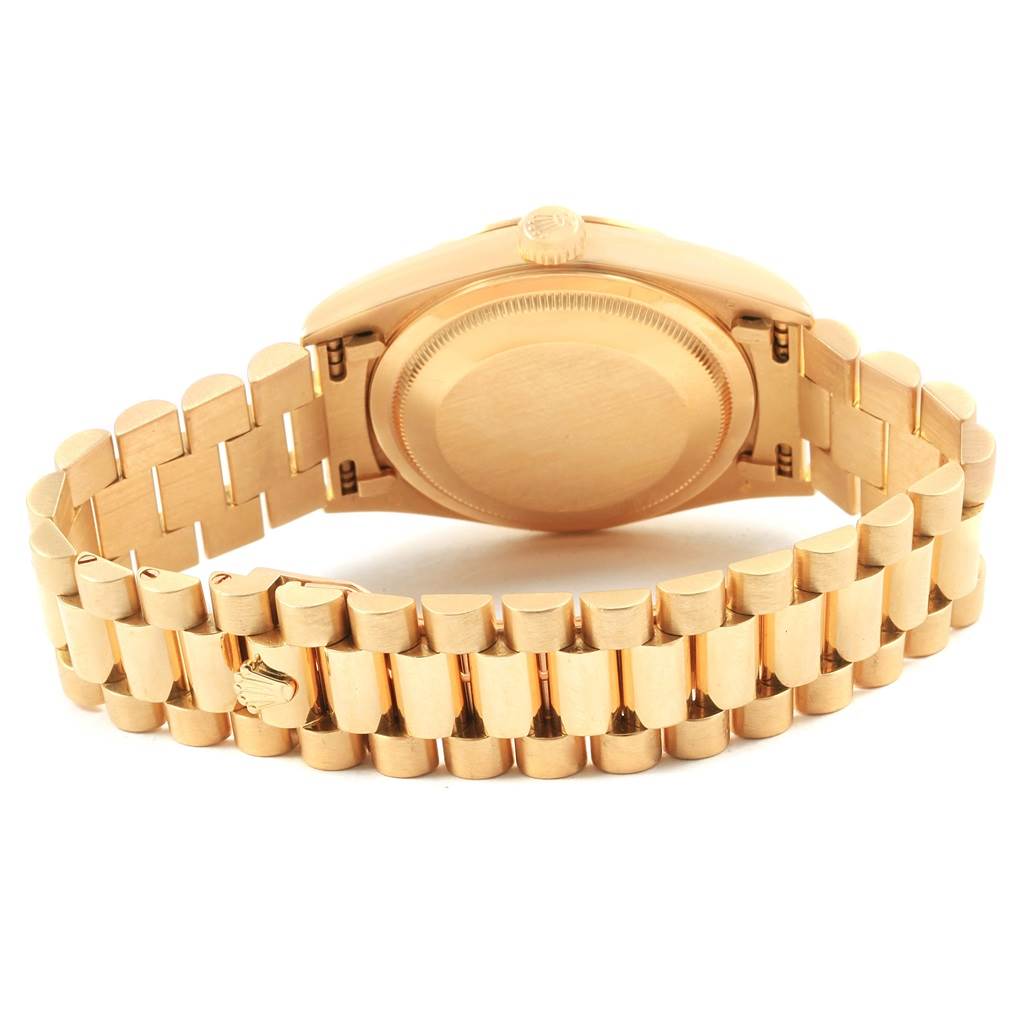 This image shows the back view of a Rolex President 18238 Men
s Yellow Gold Champagne Dial 18238 Men
s Yellow Gold Champagne Dial model watch, highlighting the case back and gold bracelet.