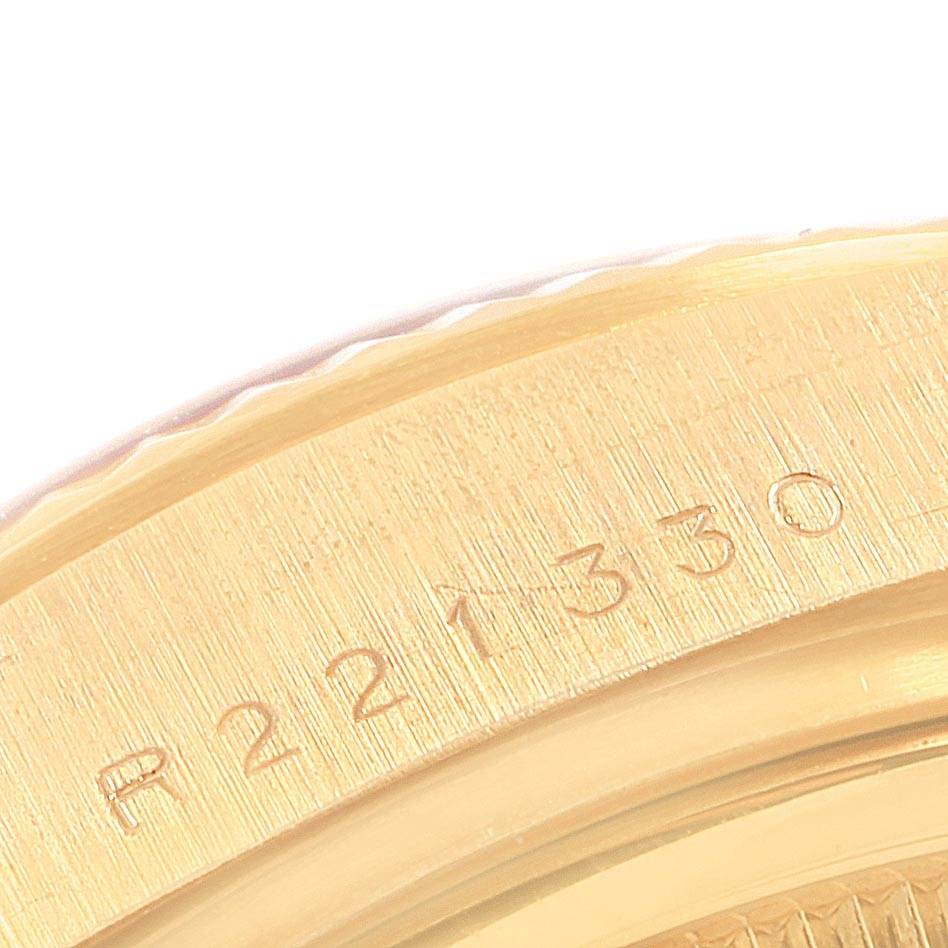 This image shows a close-up of the engraved serial number on the case of a Rolex President 18038 Men
s Yellow Gold Silver Dial 18038 Men
s Yellow Gold Silver Dial model watch.