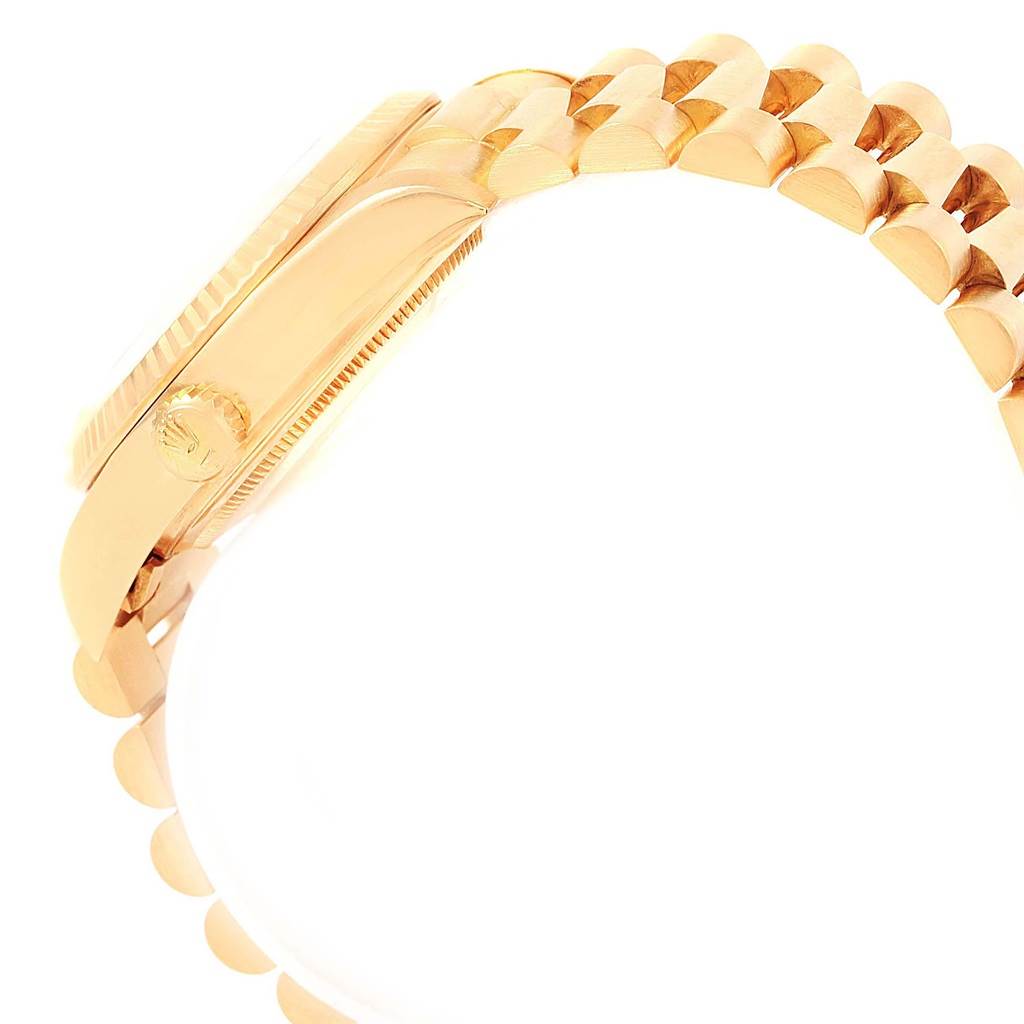 The image shows a side view of the case and part of the bracelet of a Rolex President 18038 Men
s Yellow Gold Silver Dial 18038 Men
s Yellow Gold Silver Dial model watch.